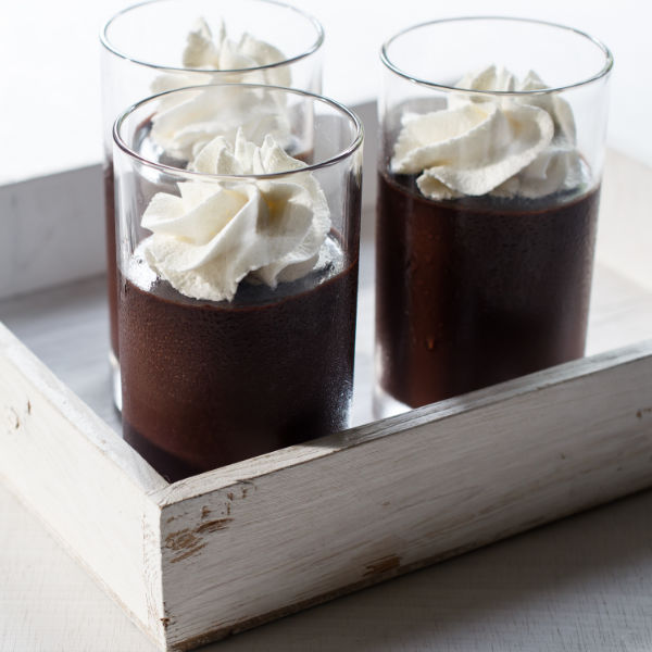 chocolate pudding topped with whipped cream